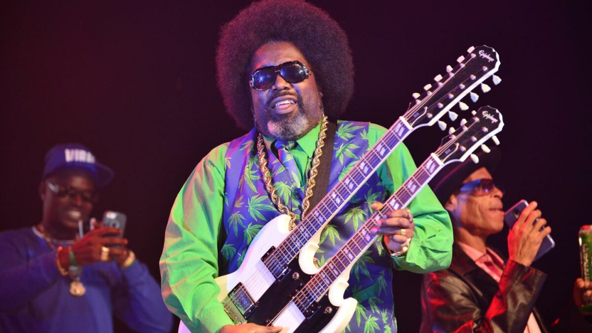 man plays bass on stage