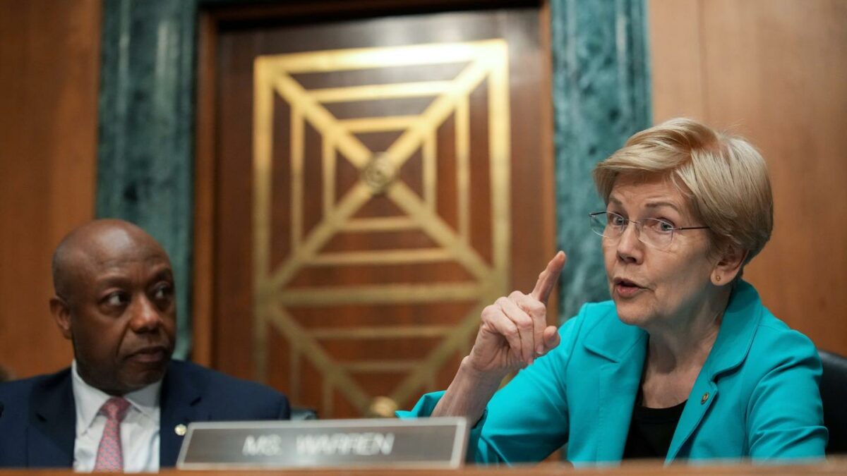 Elizabeth Warren speaks into a microphone during a Senate Banking Committee meeting